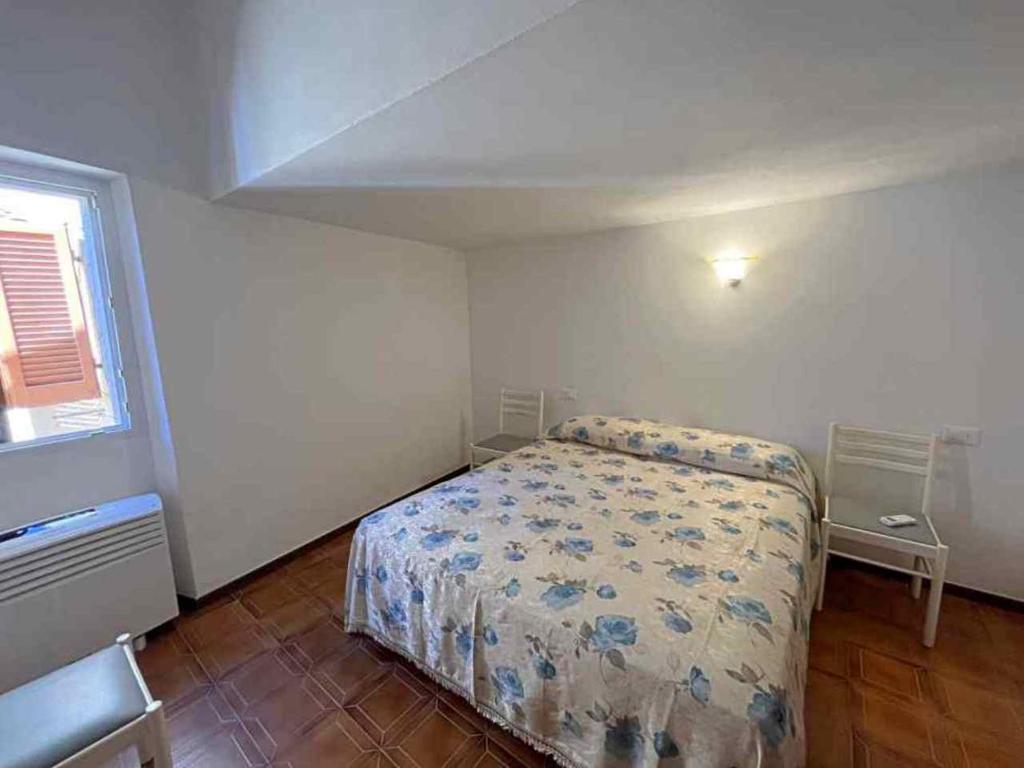 Postel nebo postele na pokoji v ubytování Ammiraglio Giglio Castello