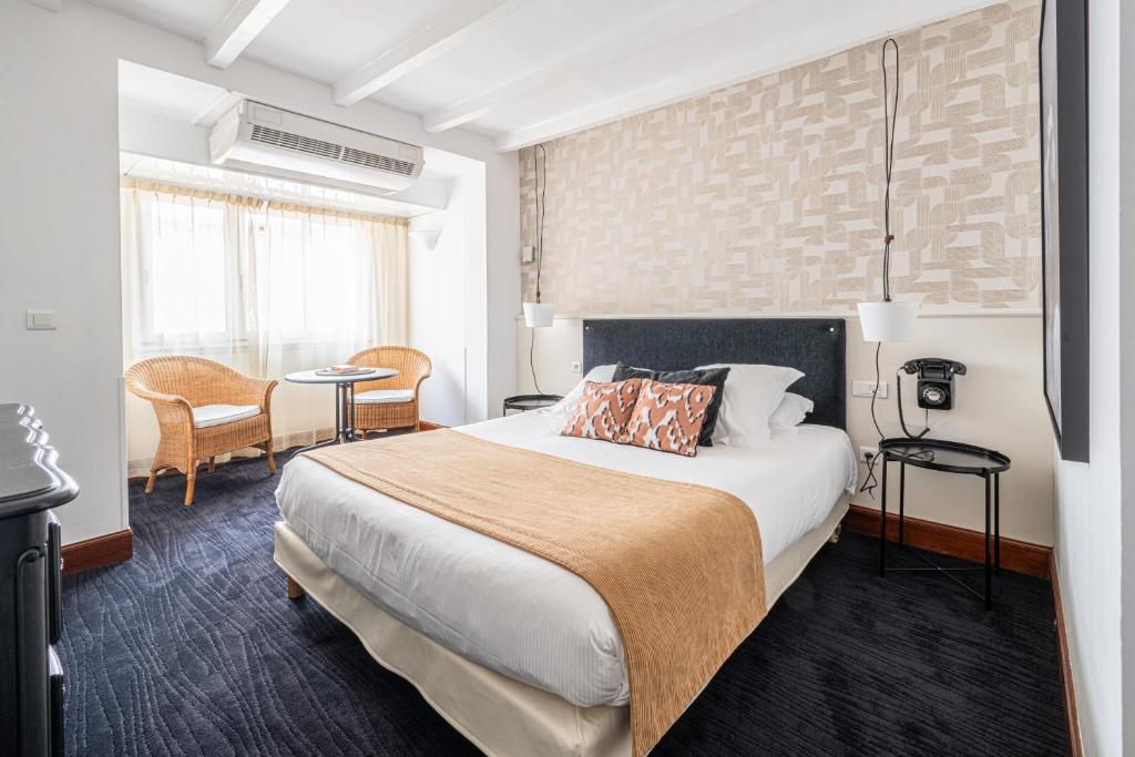 Postel nebo postele na pokoji v ubytování Hôtel Ithurria - Teritoria
