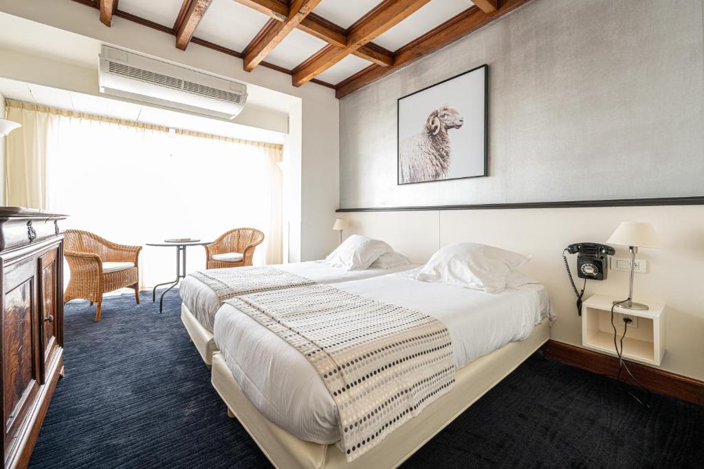Postel nebo postele na pokoji v ubytování Hôtel Ithurria - Teritoria