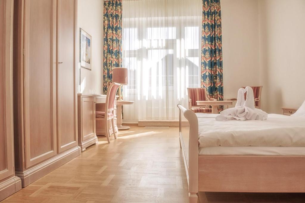 Postel nebo postele na pokoji v ubytování Augustenhof