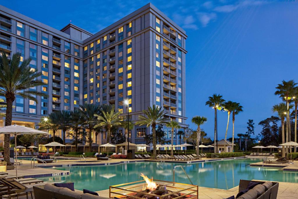 an exterior view of a resort with a swimming pool at Waldorf Astoria Orlando - An Official Walt Disney World Hotel in Orlando
