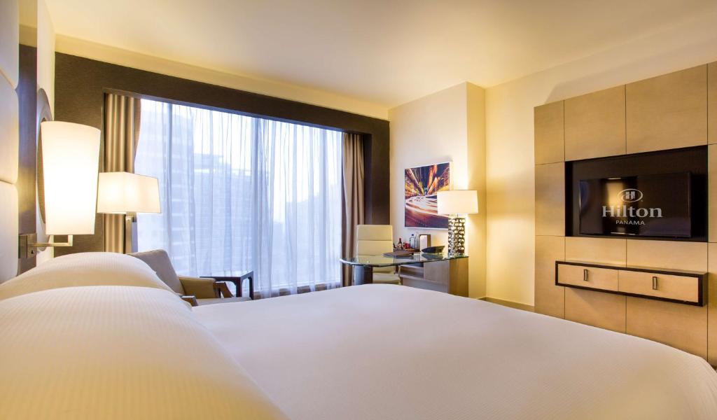 Postel nebo postele na pokoji v ubytování Hilton Panama