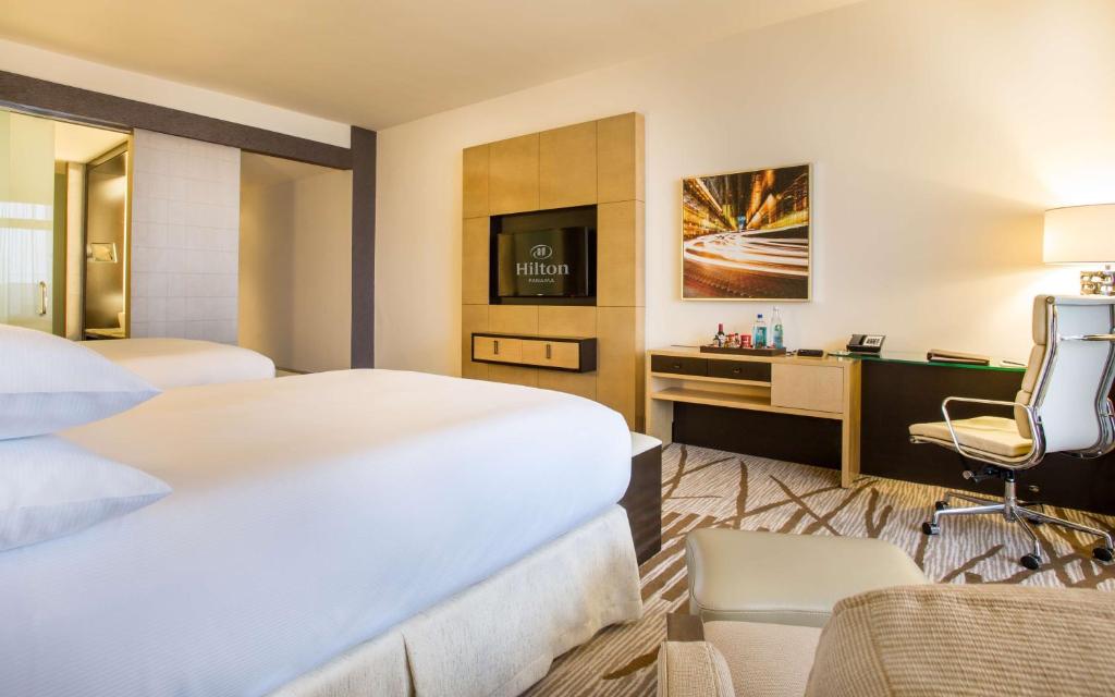 Postel nebo postele na pokoji v ubytování Hilton Panama
