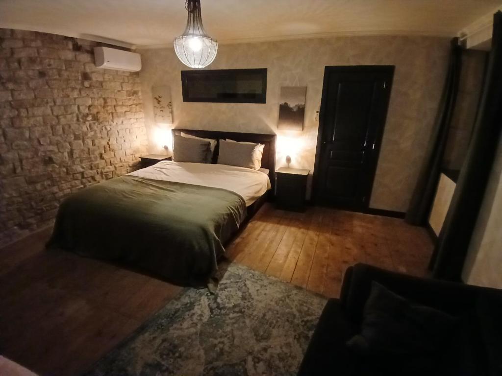 Postel nebo postele na pokoji v ubytování Manoir La Cerise