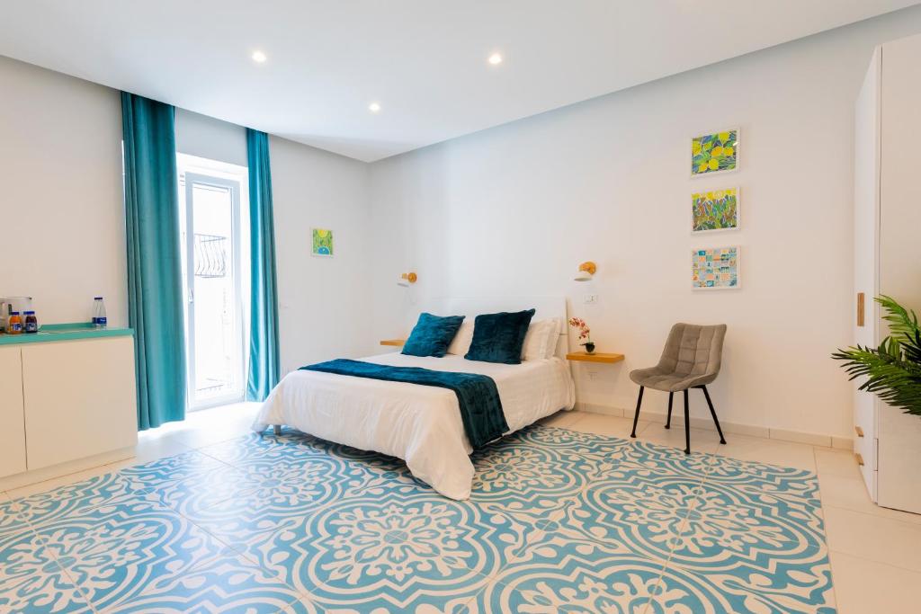 Postel nebo postele na pokoji v ubytování Via Roma Suites