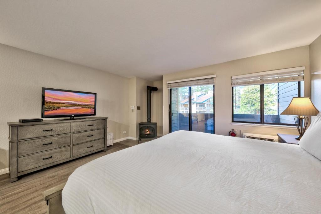 a bedroom with a large bed and a flat screen tv at Lakeland Village 107 Laugh Love Updated Studio in South Lake Tahoe