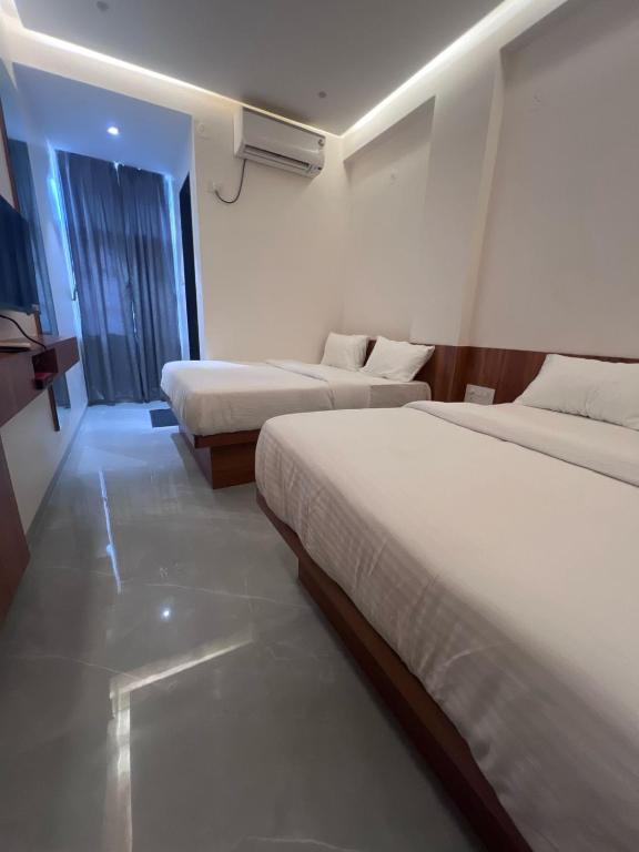 Postel nebo postele na pokoji v ubytování Hotel Rudraksh