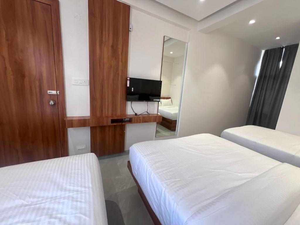 Postel nebo postele na pokoji v ubytování Hotel Rudraksh