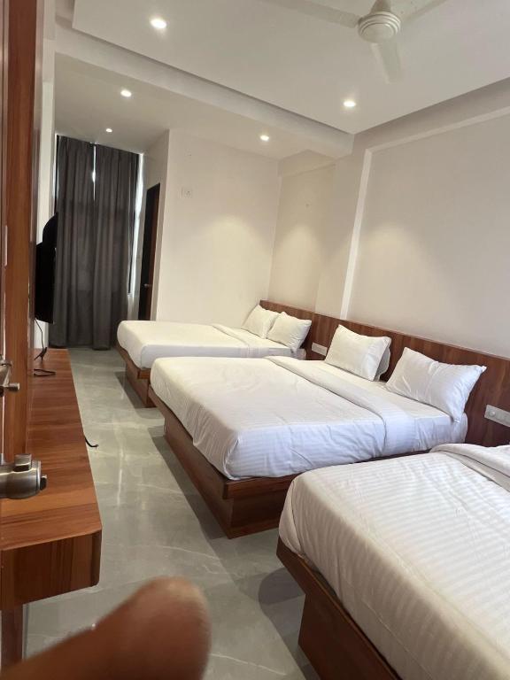 Postel nebo postele na pokoji v ubytování Hotel Rudraksh