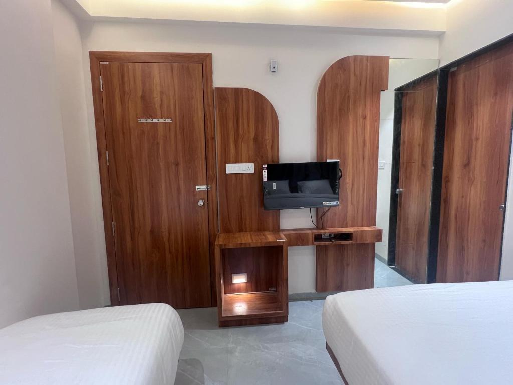 Postel nebo postele na pokoji v ubytování Hotel Rudraksh