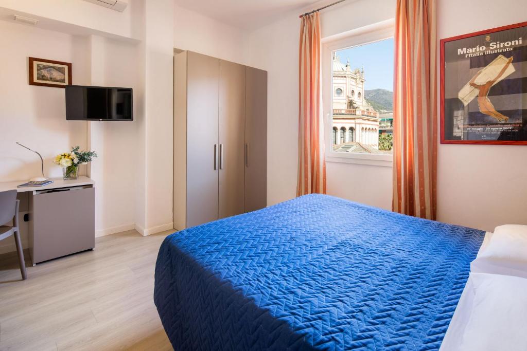 Postel nebo postele na pokoji v ubytování Albergo La Piazzetta
