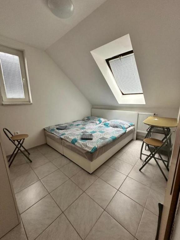 Postel nebo postele na pokoji v ubytování Penzion Pod sklepy