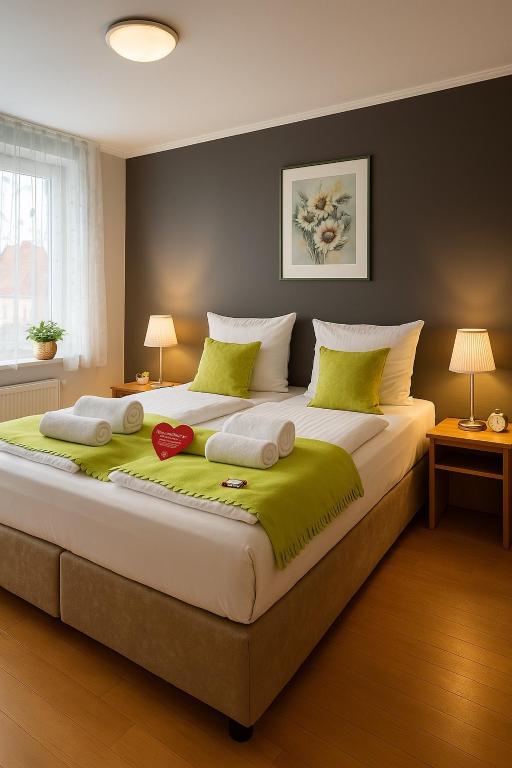 Postel nebo postele na pokoji v ubytování Hotel Schultheiss Hameln