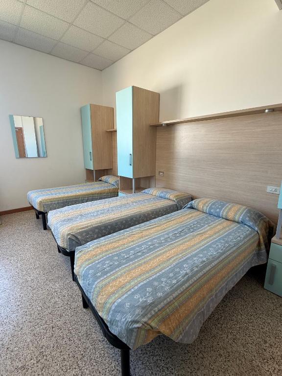 Postel nebo postele na pokoji v ubytování Ostello Casa Celeste sul Mare