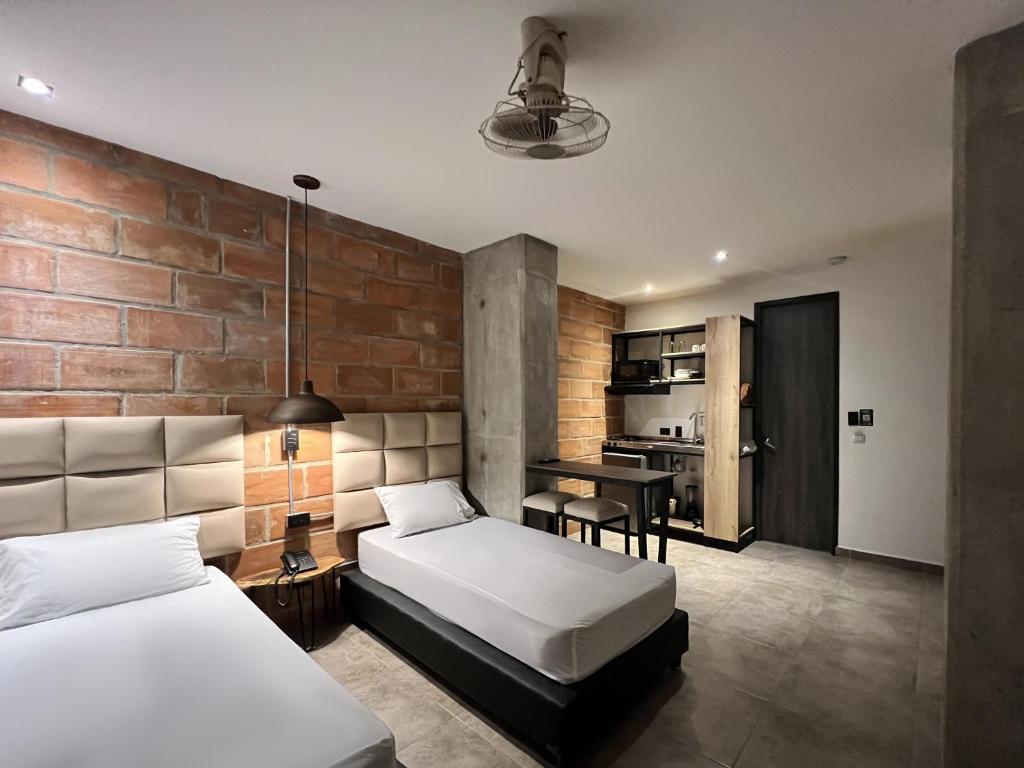 Postel nebo postele na pokoji v ubytování Apartahotel con Piscina