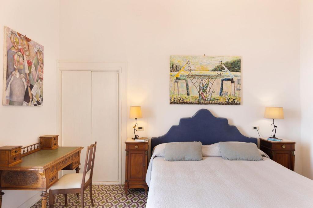 Postel nebo postele na pokoji v ubytování Villa Mundis Relais