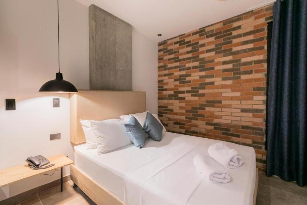 Postel nebo postele na pokoji v ubytování Apartahotel con Piscina