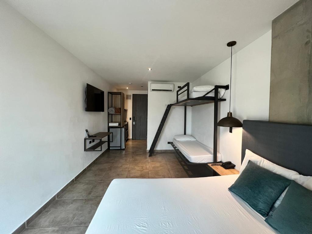 Postel nebo postele na pokoji v ubytování Apartahotel con Piscina