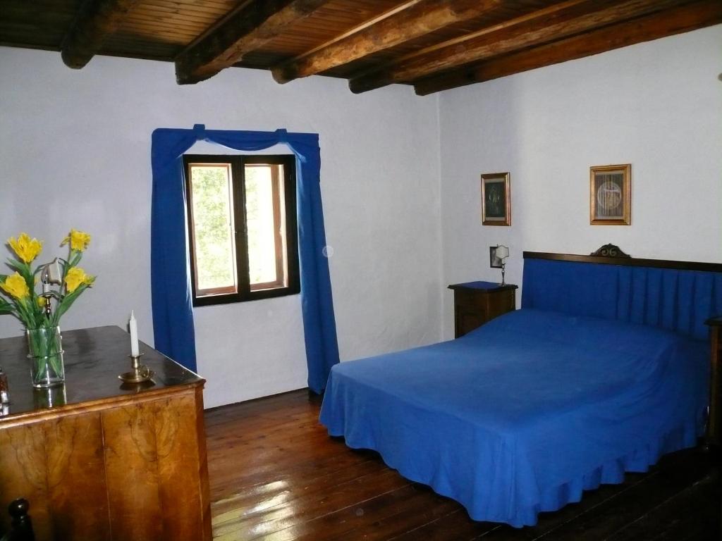 Postel nebo postele na pokoji v ubytování Agriturismo Beria de Carvalho de Puppi