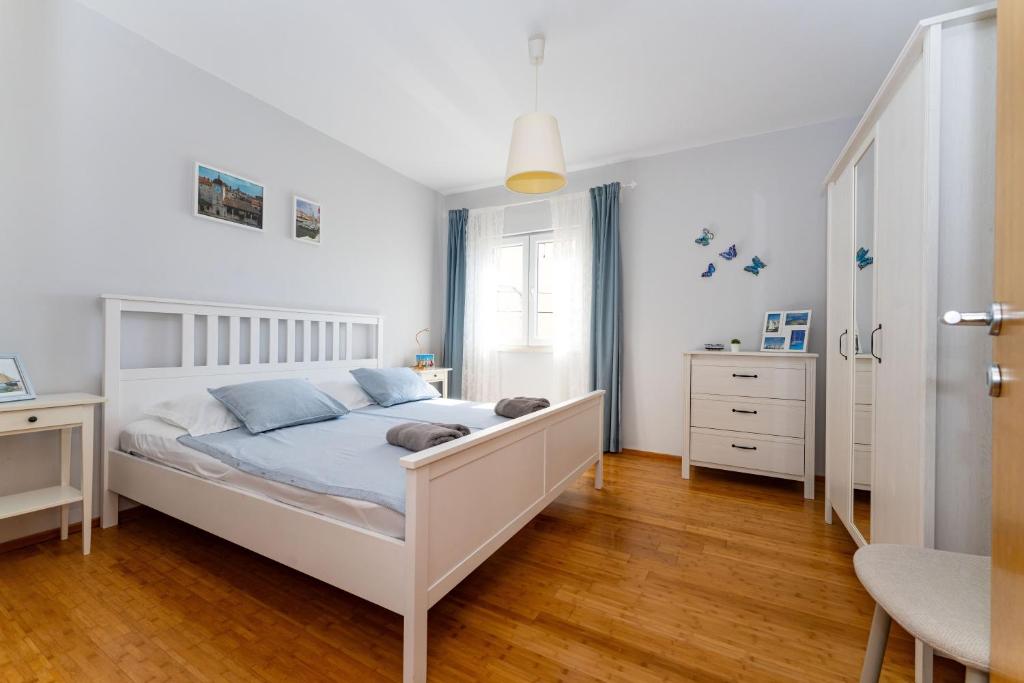 Posteľ alebo postele v izbe v ubytovaní ApartmentHouse Ivana
