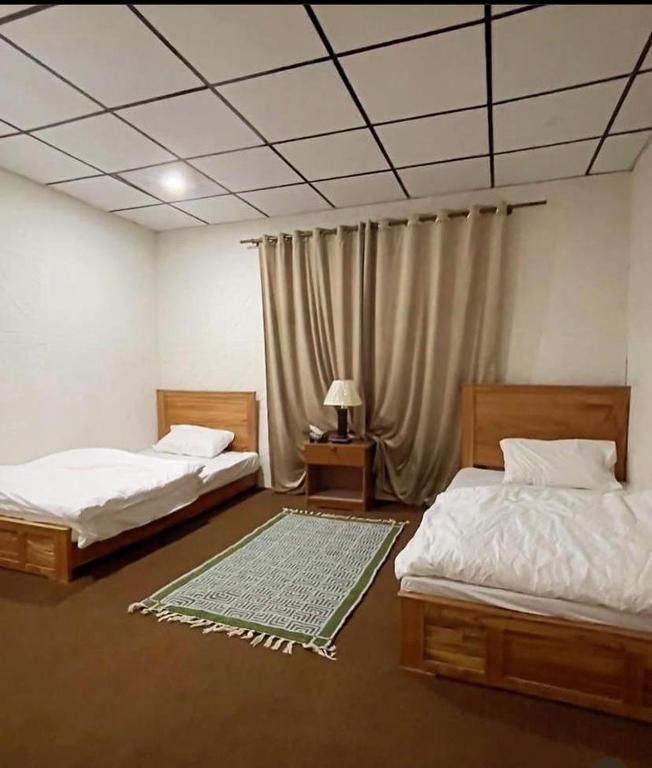 Postel nebo postele na pokoji v ubytování Hotel Destiny Skardu