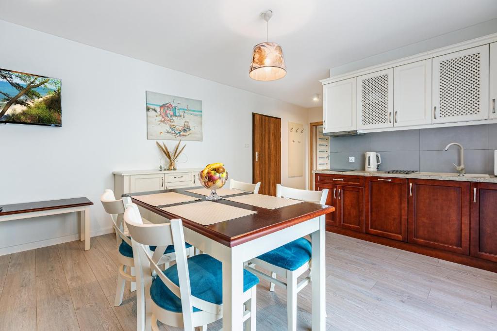 Kuchyňa alebo kuchynka v ubytovaní Malta Apartamenty - 200m do Plaży - Komfort i Wygoda dla Całej Rodziny