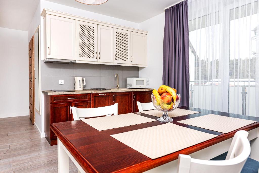 Kuchyňa alebo kuchynka v ubytovaní Malta Apartamenty - 200m do Plaży - Komfort i Wygoda dla Całej Rodziny