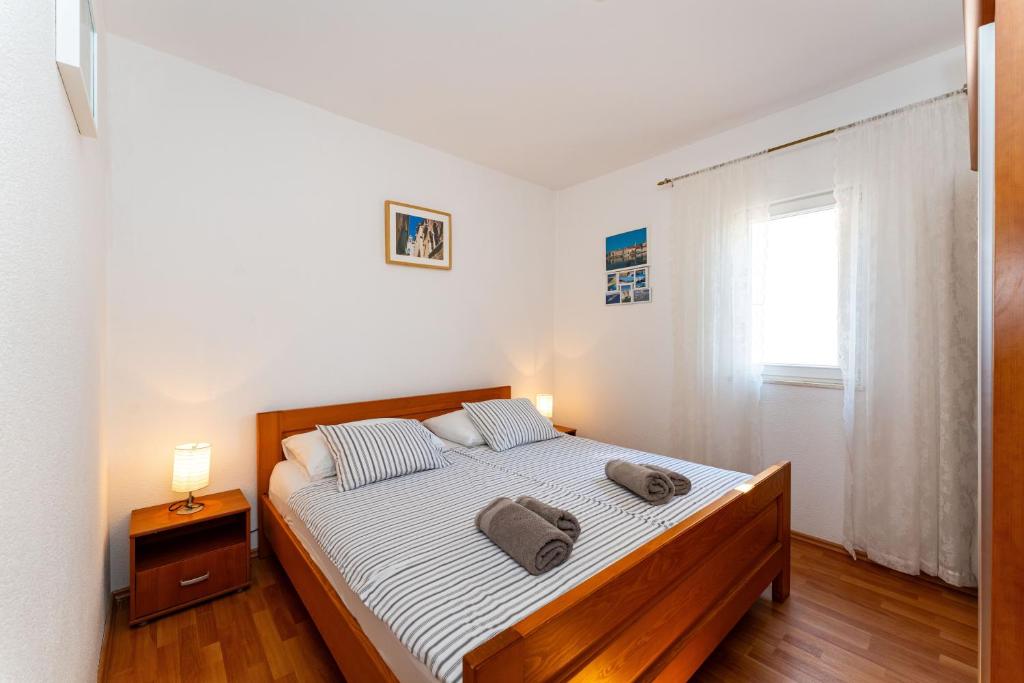 Posteľ alebo postele v izbe v ubytovaní ApartmentHouse Ivana