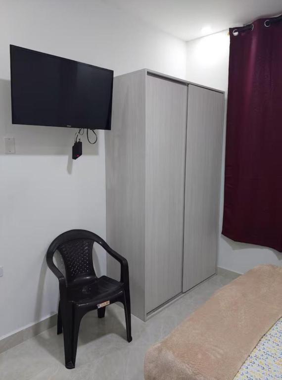 TV a/nebo společenská místnost v ubytování Perla del río habitaciones