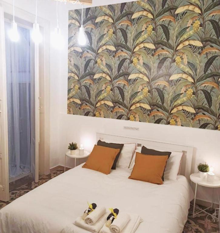 Posteľ alebo postele v izbe v ubytovaní Appartamento con cortile a 30 mt. dal mare