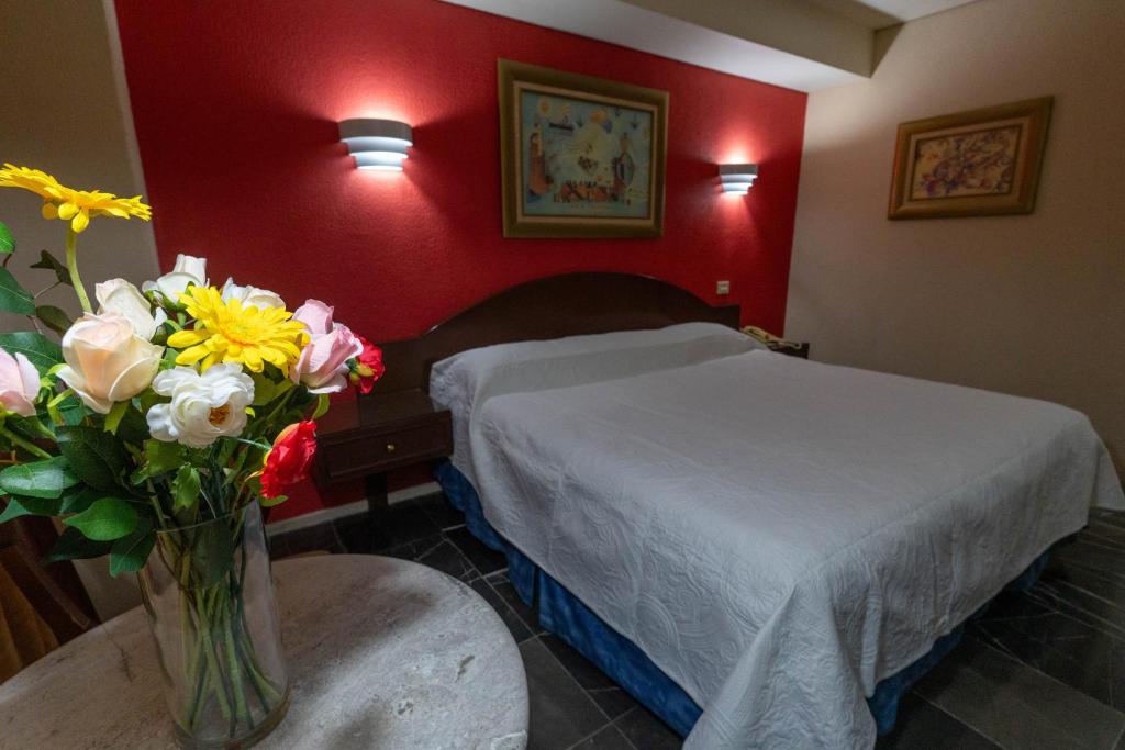 Postel nebo postele na pokoji v ubytování Hotel Tapachula