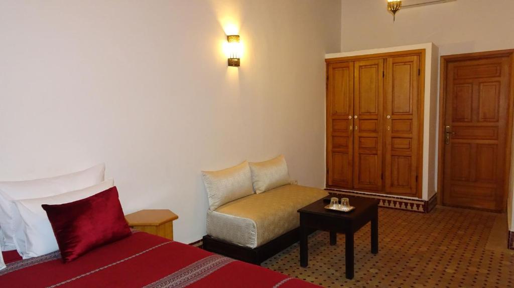 Postel nebo postele na pokoji v ubytování Riad Sabah