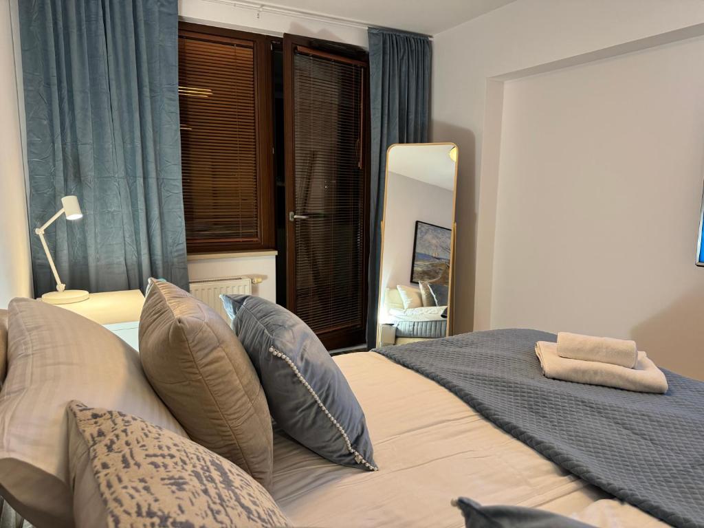 Postel nebo postele na pokoji v ubytování Comfy Apartments - Transatlantyk Lux
