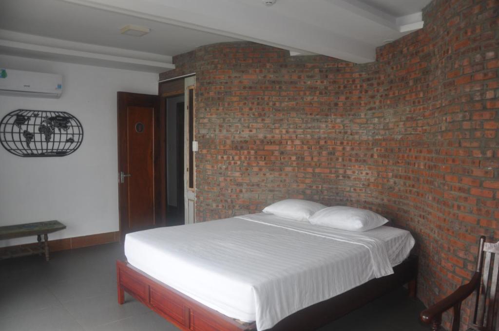 Postel nebo postele na pokoji v ubytování Autumn Bay Retreat Hoi An