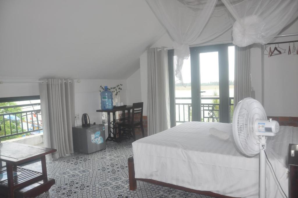 Postel nebo postele na pokoji v ubytování Autumn Bay Retreat Hoi An