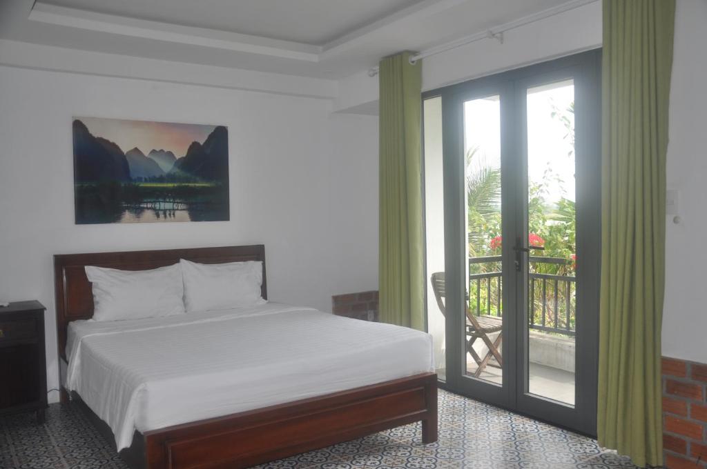Postel nebo postele na pokoji v ubytování Autumn Bay Retreat Hoi An