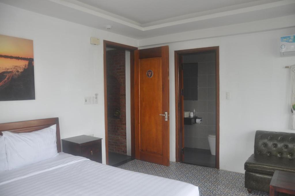 Postel nebo postele na pokoji v ubytování Autumn Bay Retreat Hoi An