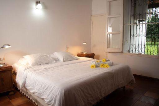 Postel nebo postele na pokoji v ubytování Laguna Kare Hotel Campo