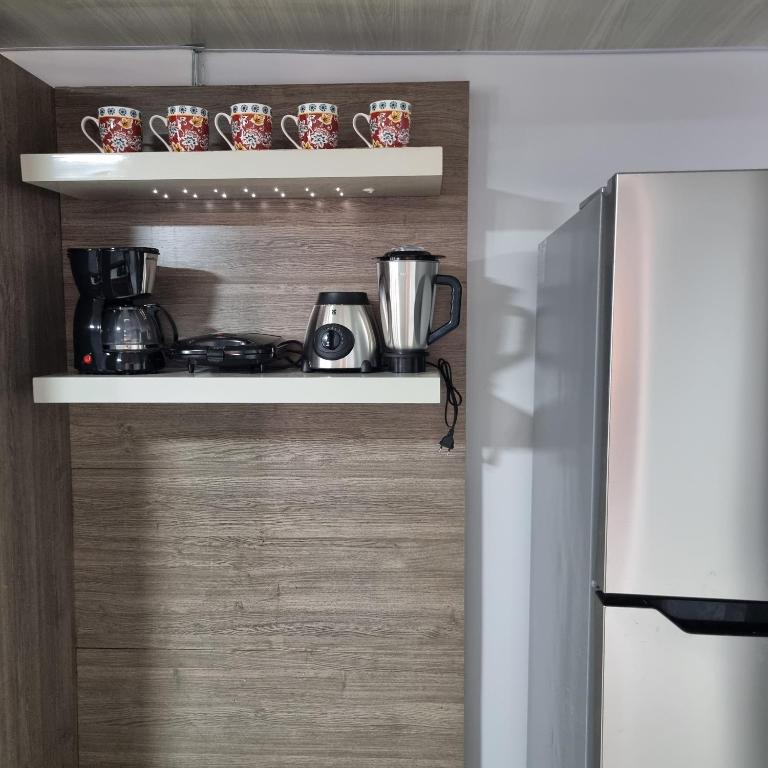 Kuchyň nebo kuchyňský kout v ubytování Quarto privado em casa com piscina compartilhada e a 6 minutos do centro da cidade