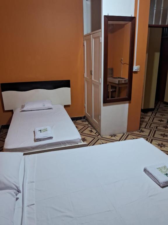 Postel nebo postele na pokoji v ubytování Plaza Jungle Hostel