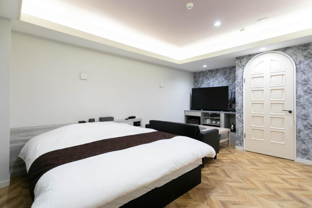 TV a/nebo společenská místnost v ubytování Hotel TEMARI Matsumoto