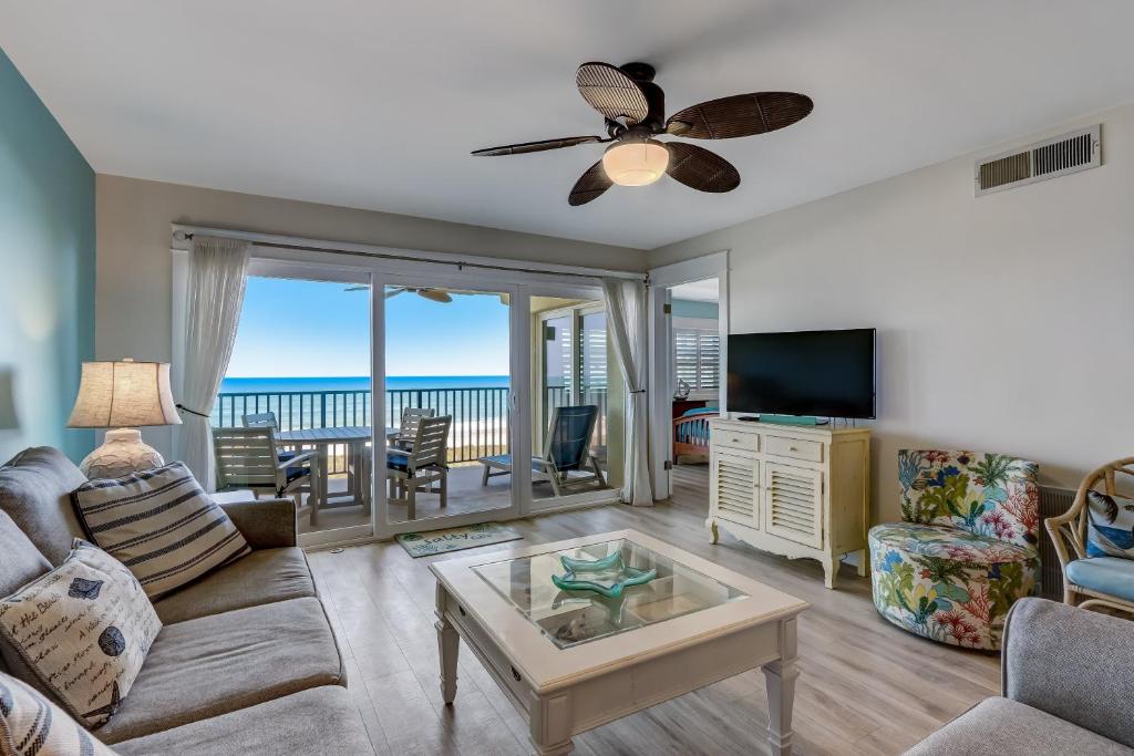 a living room with a view of the ocean at Kid Friendly Condo with Stunning View of the Atlantic in Fernandina Beach