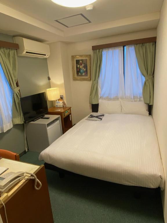 Postel nebo postele na pokoji v ubytování Hotel Tateshina