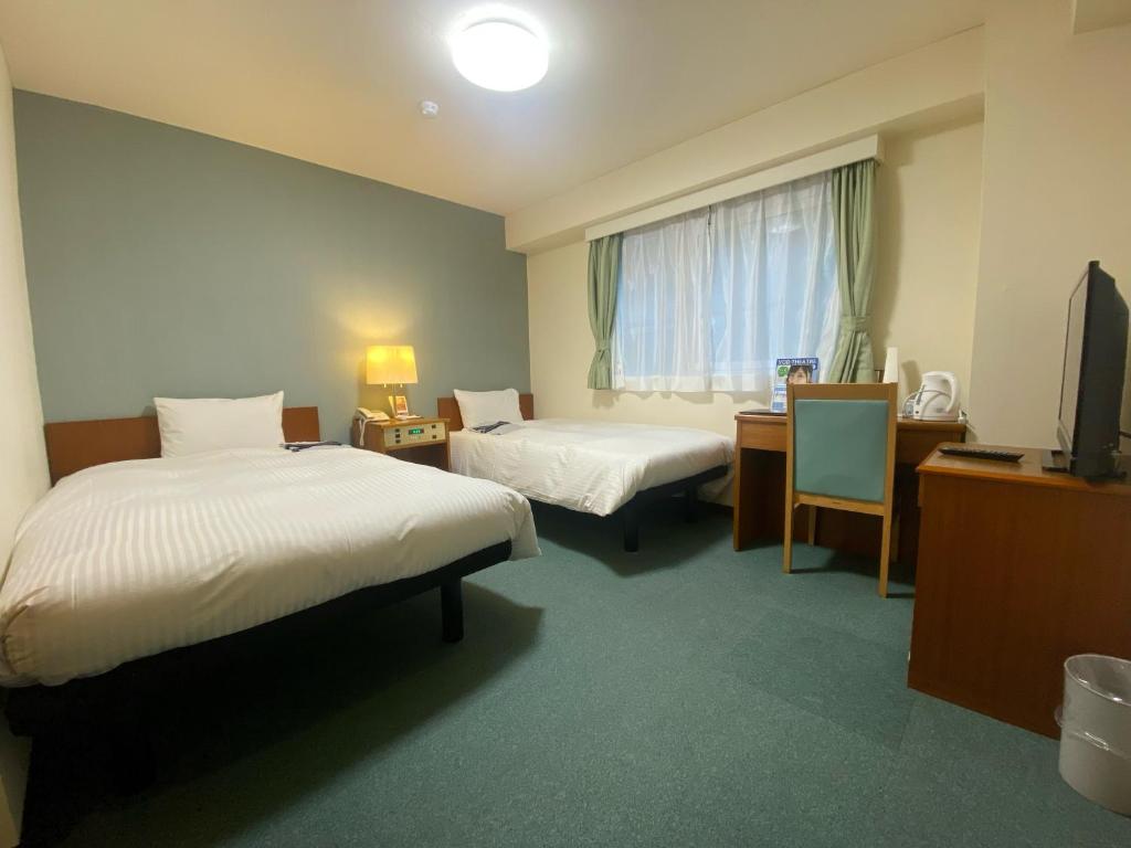 Postel nebo postele na pokoji v ubytování Hotel Tateshina