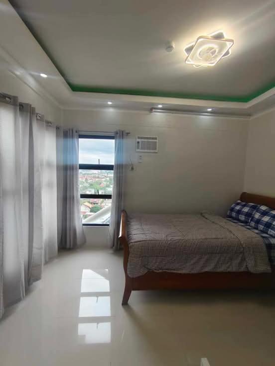 Postel nebo postele na pokoji v ubytování Cosy Nest Royal Oceancrest Mactan