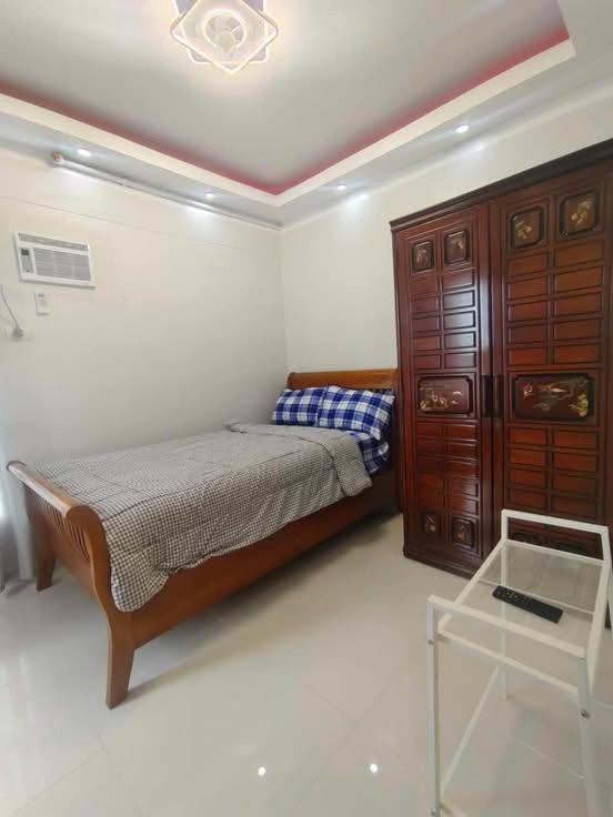 Postel nebo postele na pokoji v ubytování Cosy Nest Royal Oceancrest Mactan