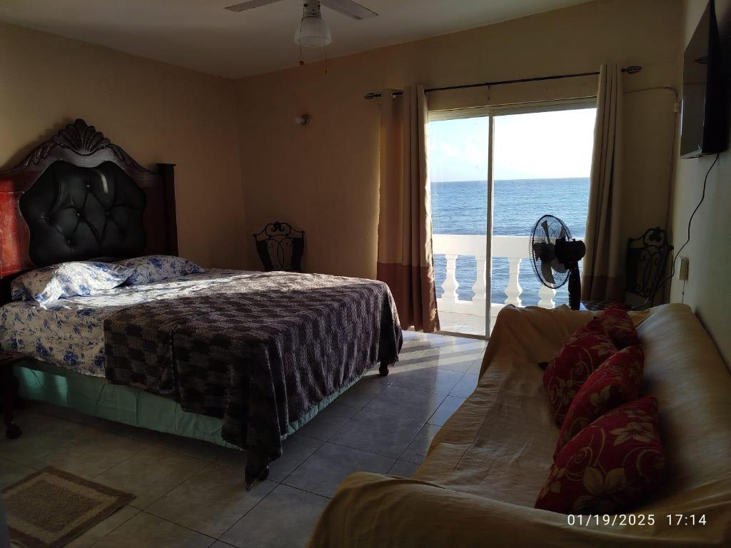 Ένα ή περισσότερα κρεβάτια σε δωμάτιο στο Ocean view escape