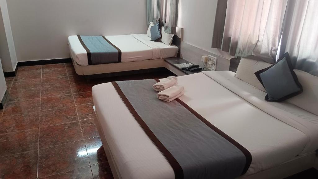 Postel nebo postele na pokoji v ubytování Hotel Kiara Eshosans Palace