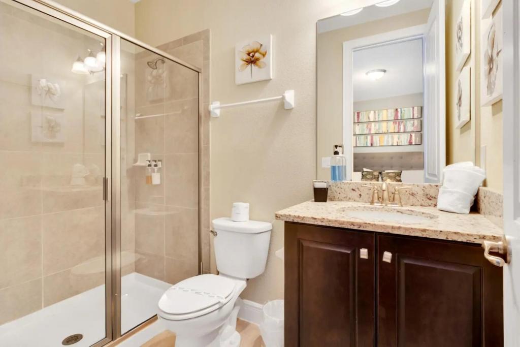 a bathroom with a shower and a toilet and a sink at 491-8-LD-Private Pool with Game and Movie in Orlando