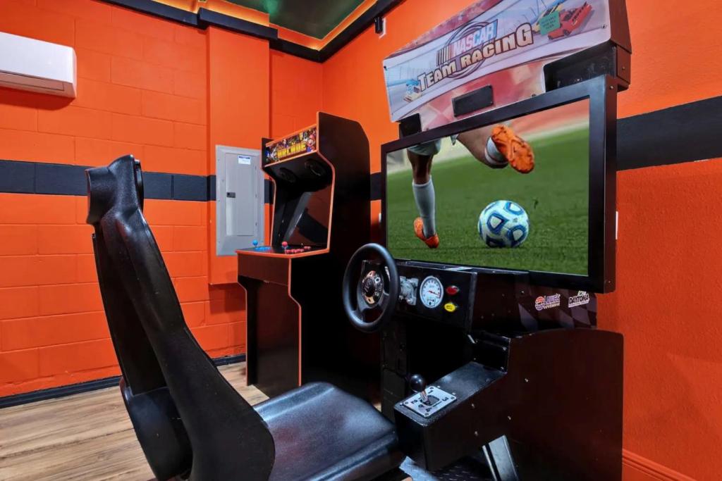 a video game room with a video game system at 491-8-LD-Private Pool with Game and Movie in Orlando